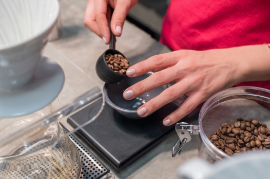 coffee beans being weighed on a food scale